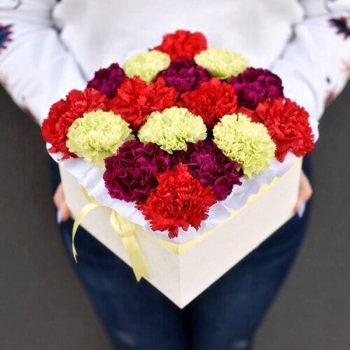 Multicolored carnations in a square box